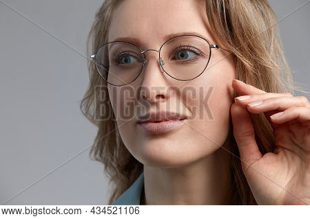 Confident Young Business Woman 35-45 Years Old, Blonde Stilish Formal Clothes And Glasses, Gray Back