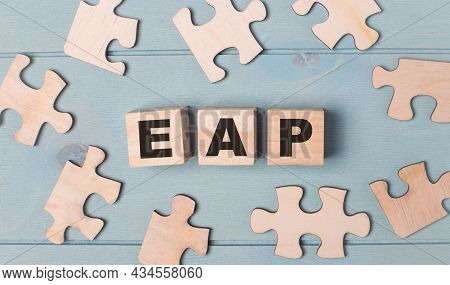 Blank Puzzles And Wooden Cubes With The Text Eap Employee Assistance Program