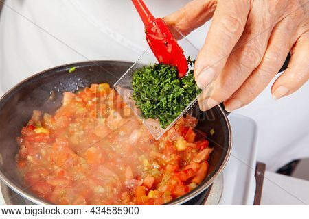 Preparation Of The Traditional Colombian Hogao Or Criollo Sauce (salsa Criolla) Made Of Onion, Tomat