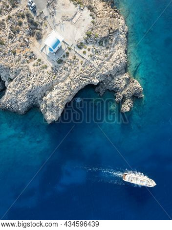 Drone Aerial Photograph Of Cape Greko Peninsula With Agioi Anargyroi Church On The Rocks. Cruise Tou