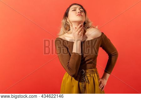 Portrait Of Sad Woman With Blonde Hair And Closed Eyes Palping Neck Feeling Throat Ache And Pain Dur