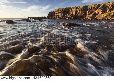 Water Flowing In The Ocean Looking Towards A Cliff At Windang Island On Nsw South Coast