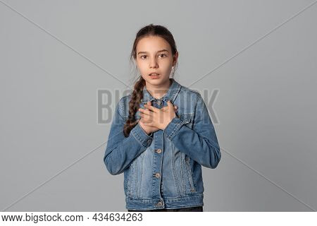 Stunned Preteen Girl Female Stares At Camera, Looks Surprisingly, Dumbstruck Shocked Gasping, Realiz