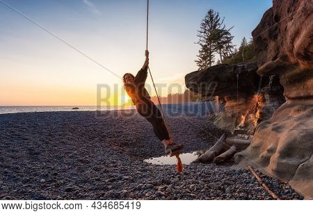 Adventurous White Caucasian Woman At Sandcut Beach On The West Coast Of Pacific Ocean. Summer Sunny 