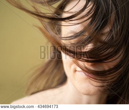 Wellness, Cosmetics And Hairstyle. Portrait Of Beautiful Woman Model With Flying Straight Hair Whick