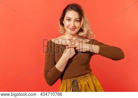 Internet Trends. Portrait Of Charming Happy Woman In Brown Blouse Crossing Fingers To Make Hashtag S
