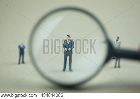 Miniature People: Magnifying Glass Focusing On The Selection Of Executive Businessman, Recruitment P
