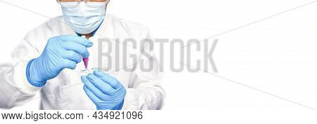 The Doctor Placing The Secretions Sample Into The Sars Cov-2 Rapid Antigen Test Kit (atk) With The E