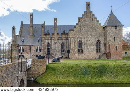 Medemblik, Noord-holland, Netherlands. April 14, 2021. Facade Of Radboud Castle, Brick Walls, Cannon