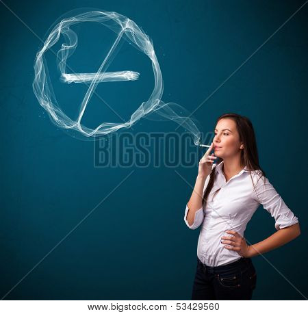 Pretty young lady smoking unheathy cigarette with no smoking sign