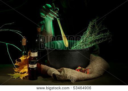  Witch in scary Halloween laboratory on dark color background