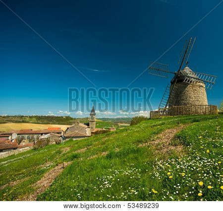 Old windmill in front of Lautrec village, France 
