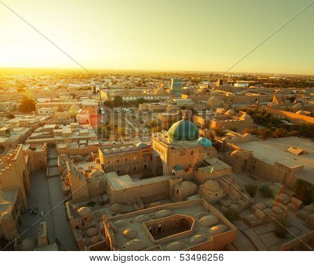 Ancient city of Khiva at sunset. Aerial view from top of a minaret