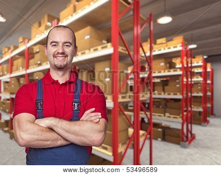 portrait of caucasian handymanand warehouse background