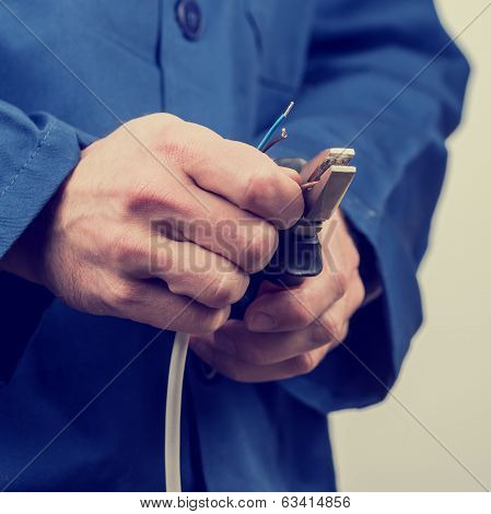Electrician Working On Wiring