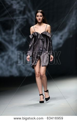 ZAGREB, CROATIA - APRIL 10 : Fashion model wears clothes made by Petra Vuletic and Sasa Hortig on 