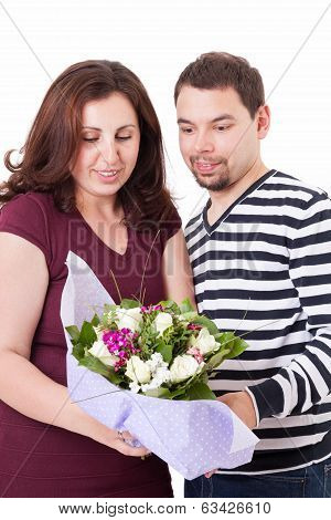 Happy Couple Unwrap A Bouquet Of Flowers