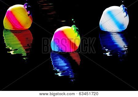 Three Illuminated Buoys At Night