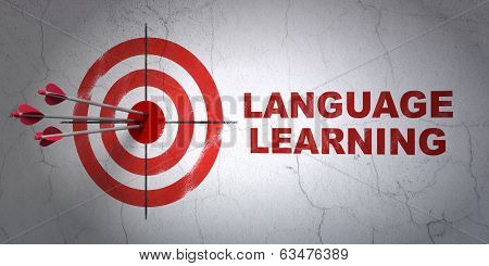 Education concept: target and Language Learning on wall background