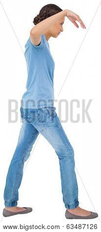Powerless brunette in jeans and tshirt on white background