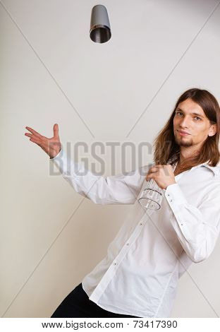 Young Man With Shaker Making Cocktail Drink