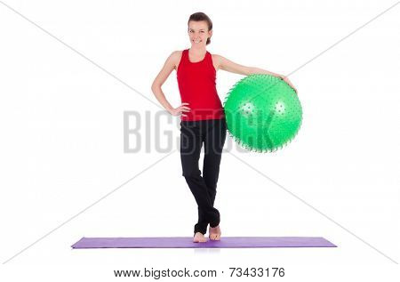 Young woman exercising with swiss ball
