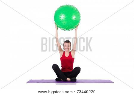 Young woman exercising with swiss ball