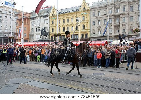 ZAGREB, CROATIA - OCTOBER 04: The parade of 70 participants, thirty horses and forty members of a brass band to the main square were announced next, 300th Sinjska Alka, on October 04, 2014 in Zagreb.