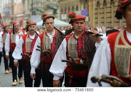 ZAGREB, CROATIA - OCTOBER 04: The parade of 70 participants, thirty horses and forty members of a brass band to the main square were announced next, 300th Sinjska Alka, on October 04, 2014 in Zagreb.