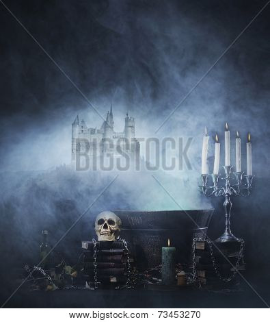 Halloween background with a spooky witchcraft tools over an ancient castle background 