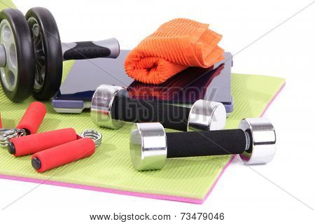 Sport requisites on a carpet isolated on white