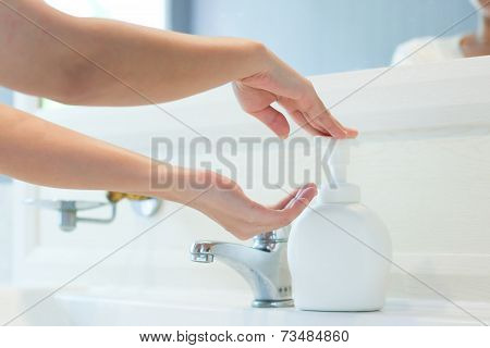 Hands Applying Sanitizer Soap