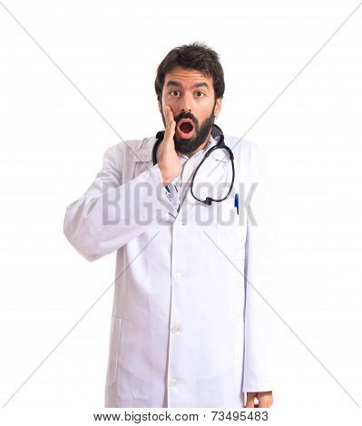 Doctor Doing Surprise Gesture Over White Background