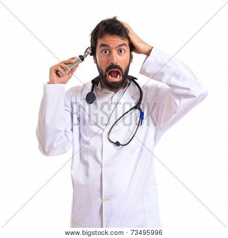 Crazy Otorhinolaryngologist With His Otoscope Over White Background
