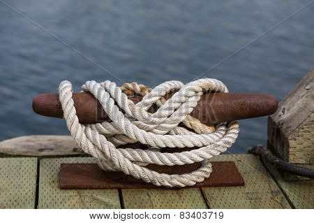 White Rope On Rusty Cleat