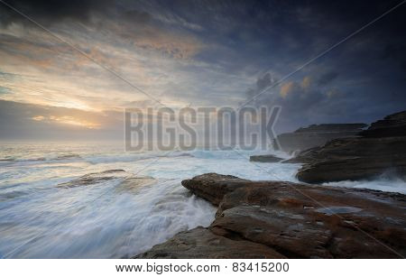 Wild Ocean Surges Over Steadfast Rocks