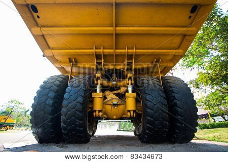 Heavy mining truck in mine and driving along the opencast. Photo of the big mine truck