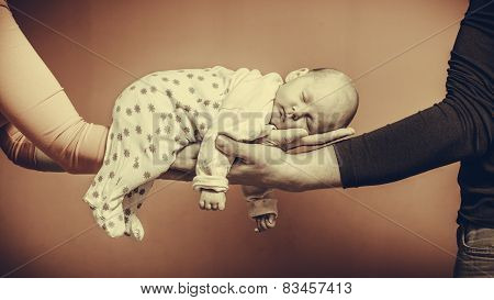 Newborn Baby Girl In The Comfort Of Moms Arms