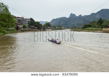 Vang Vieng, Lao P.d.r. - October 24 : Unidentified Tourists Are Rowing Kayak Boats In Song River On