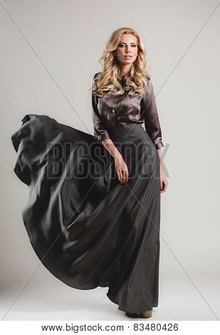 The model comes on the catwalk during a fashion show.