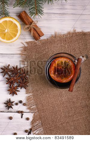 Mulled wine, punch and spices for glintwine on wooden background