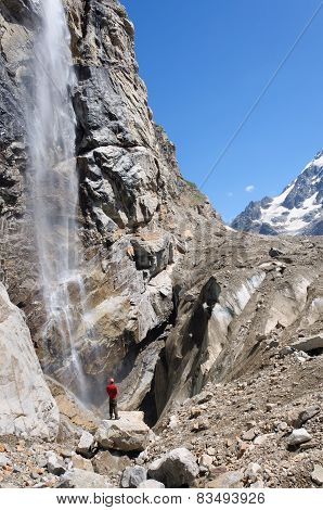 Tourist looks at highest waterfall