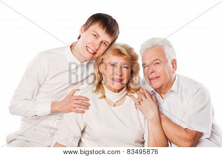 Happy senior couple with son. Isolated on white background.