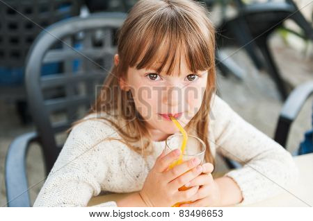 Little girl in a cafe