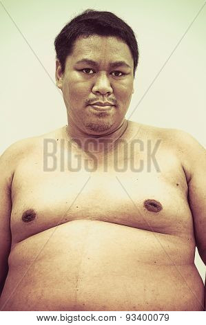 Fat Naked Upper Body And Belly Stomach Of An Asian African Man Showing Proud Expression On His Face