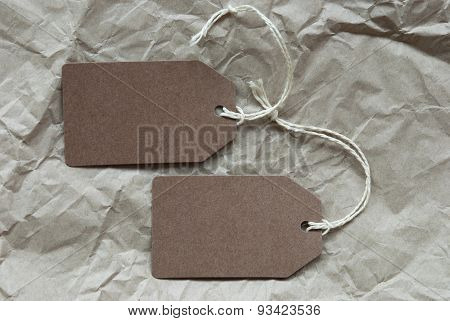 Two Brown Labels With Copy Space Paper Background