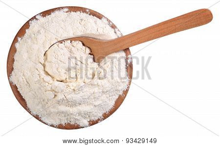 Top View Of White Flour In A Wooden Bowl With Spoon On A White
