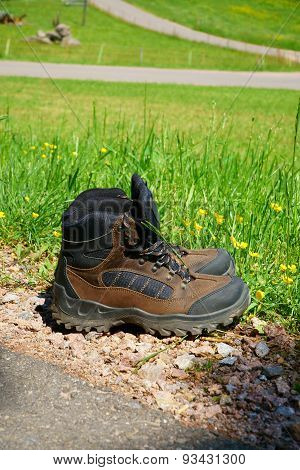 Hiking Boots Stand On The Wayside