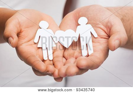 relationships and love concept - clousup of couple hands showing couple with heart shape
