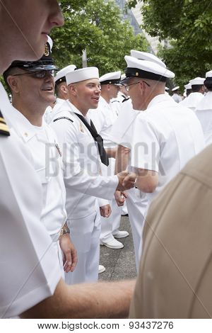 NEW YORK - MAY 22 2015: US Navy sailors line up to be congratulated after the promotion ceremony at the National September 11 Memorial site during Fleet Week 2015.
